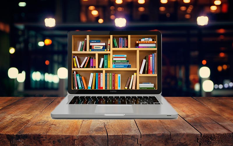 Laptop ingresando a biblioteca virtual